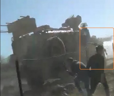 after_having_been_hit_the_protestor_falls_down_desperately_trying_to_hold_x_by_his_2_hands_as_a_shot_of_gas_is_fired_from_the_turkish_window_obs._video_ef_screenshot_400 after_having_been_hit_the_protestor_falls_down_desperately_trying_to_hold_x_by_his_2_hands_as_a_shot_of_gas_is_fired_from_the_turkish_window_obs._video_ef_screenshot_400