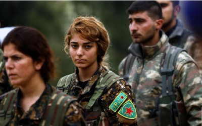 le_parisien__newspapers_photo__sad_syrian_kurdish_militants_at_a_funeral_in_quamisli_400