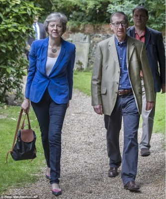 new_uk_pm_theresa_may_walking_to_church_on_sunday_with_her_husband_400