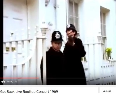 outgoing_labour_former_governments_policmen_knocking_at_beatles_door_during_controversial_get_back_song_at_famous_abbey_road_rooftop_concert_london_1969_400